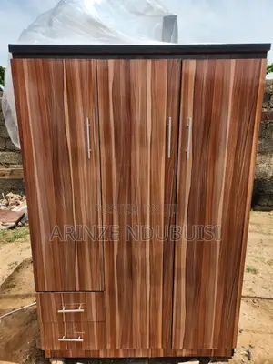 Wardrobe Features Three Doors and Two Lower Drawers
