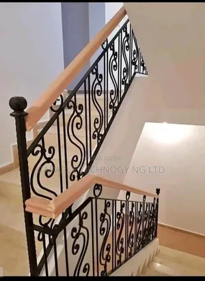 Beautiful Wronght Iron Handrail Design With Wooden Top