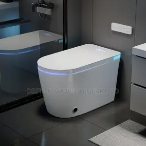 White Smart Toilet Features a Sleek, Tankless Design With a Digital.