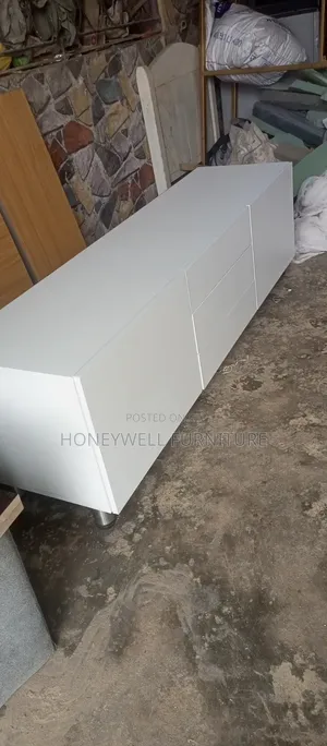 White Tv Console With Three Drawers and Two Doors