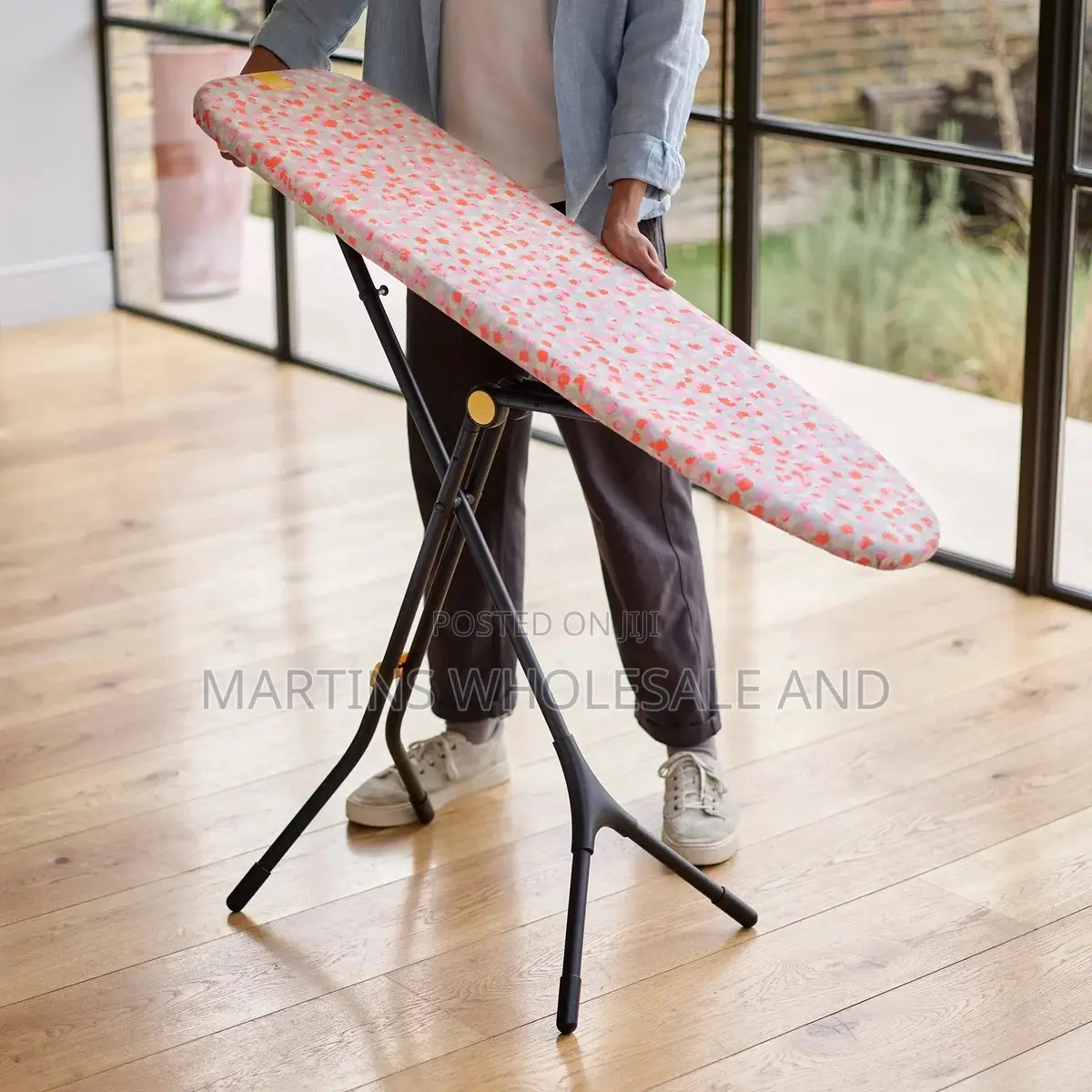 Glide Compact Ironing Board Features a Distinctive Peach-Patterned Cov