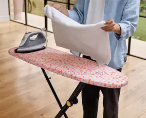 Glide Compact Ironing Board Features a Distinctive Peach-Patterned Cov