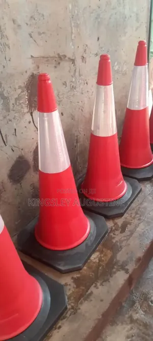 Red Traffic Safety Cones Equipped With Reflective White Bands.