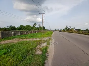 8 Acres Farm Land With Structures Fully Fenced Along Ughelli-Warri