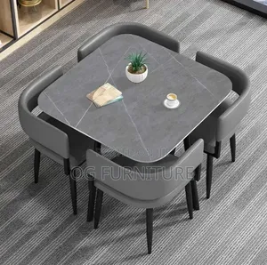 A Standard Luxury Ceramic Dinning Table With Four Chairs Available