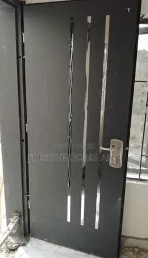 Grey Israeli Security Door With Glass Design and a Sturdy Lock System