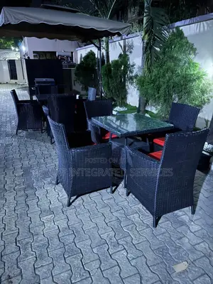Brown Outdoor Set With Red Cushions