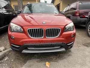 BMW X1 xDrive28i 4dr SUV AWD (2.0L 4cyl Turbo 8A) 2014 Orange