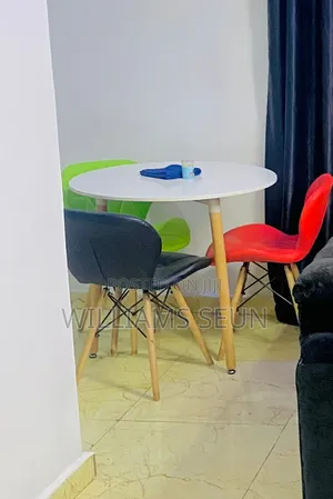 Neatly Used Center Table With Three Chairs