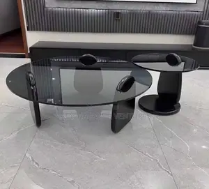 Oval Smoked Glass Coffeetable Withblacksculpturalbasematchingsidetable