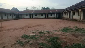 A School Built on Two Plots of Land