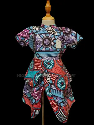 Vibrant African Print Peplum Dress – Handmade Ankara Fashion.
