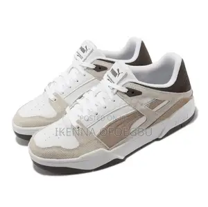 White and Brown Puma Slipstream