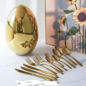 High-Gloss Joli Golden Egg Container Features a Reflective, Polished