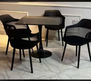 This 4-Seater Restaurant or Dining Set Features Sleek Black Nordic