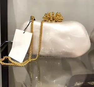 Pearlescent Gold Clasp Clutch .Comes With Box Longer Chain
