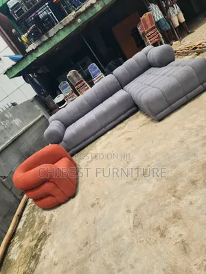 Grey Upholstery Padded L-Shaped Sofa Couch.