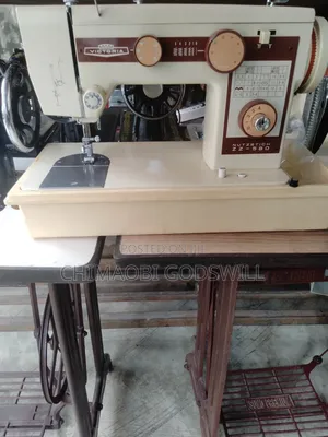Original Electric and Manual Straight and Zigzag Sewing Machine.