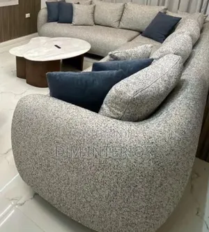 A Curved Sofa Made With Quality Materials for Beauty and Comfort