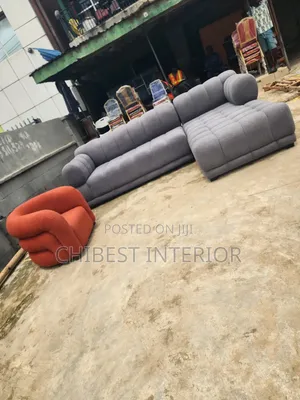 Grey L-Shaped Sofa Couch With Its Single Seater