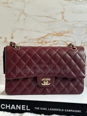 Quilted Burgundy Chanel Flap Bag Featuring a Caviar Leather Texture