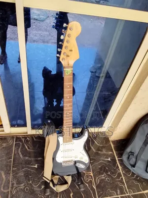 Neatly Used Strat Style Electric Guitar With Stand