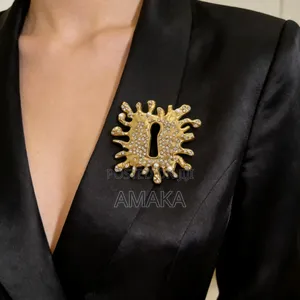 Schiaparelli Gold Keyhole Brooch Designs