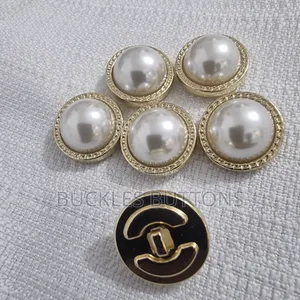 White and Gold Metal Button