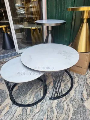 This Generic High-Quality Nested Table Set Features White Faux Marbles