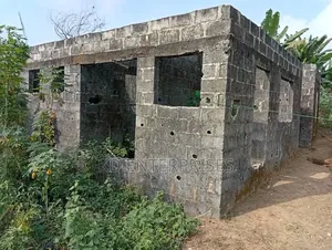 Half Plot of Land With Linked Level Building
