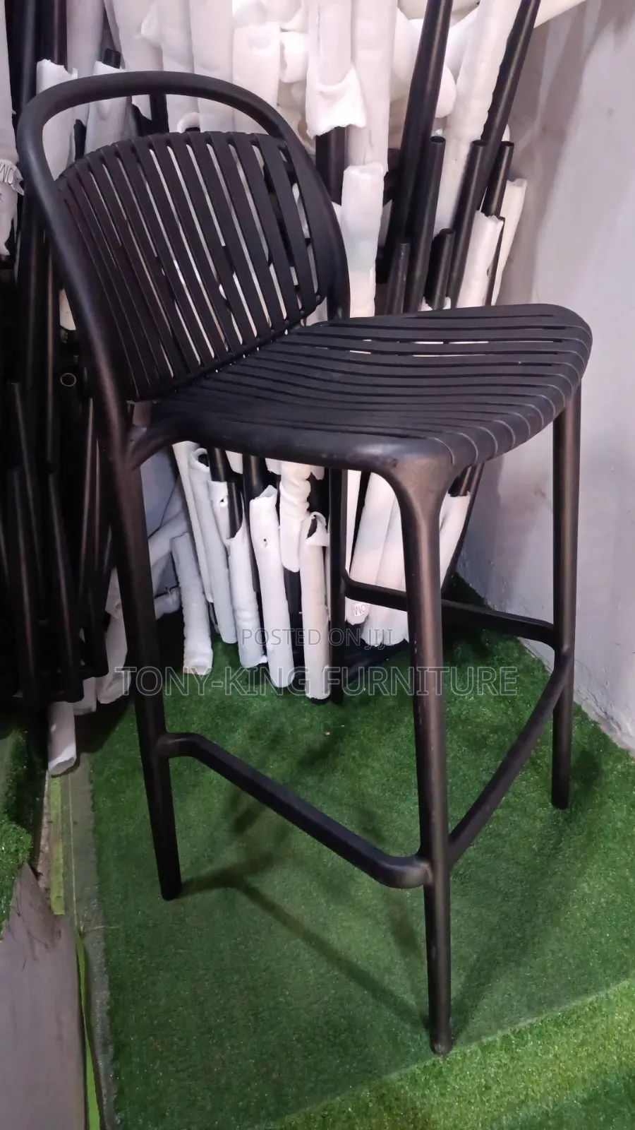 Stackable Polypropylene Bar Stool Features a Slatted Seat and Backrest
