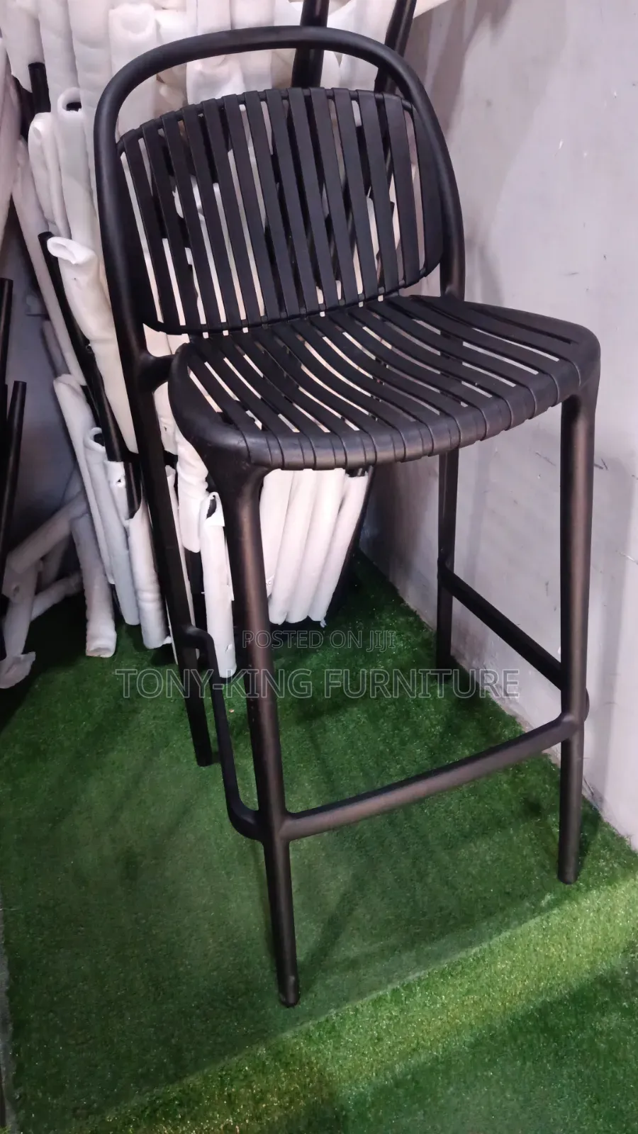 Stackable Polypropylene Bar Stool Features a Slatted Seat and Backrest