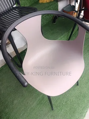 Modern Armchair With a Continuous Armrest and Backrest Design