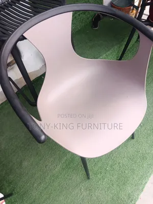 Modern Armchair With a Continuous Armrest and Backrest Design