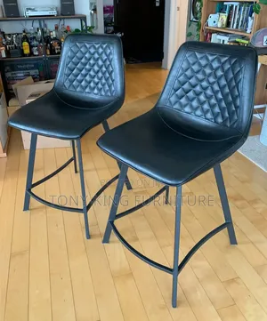 Modern Bar Chair Upholstery on a Sturdy Black Metal Base.