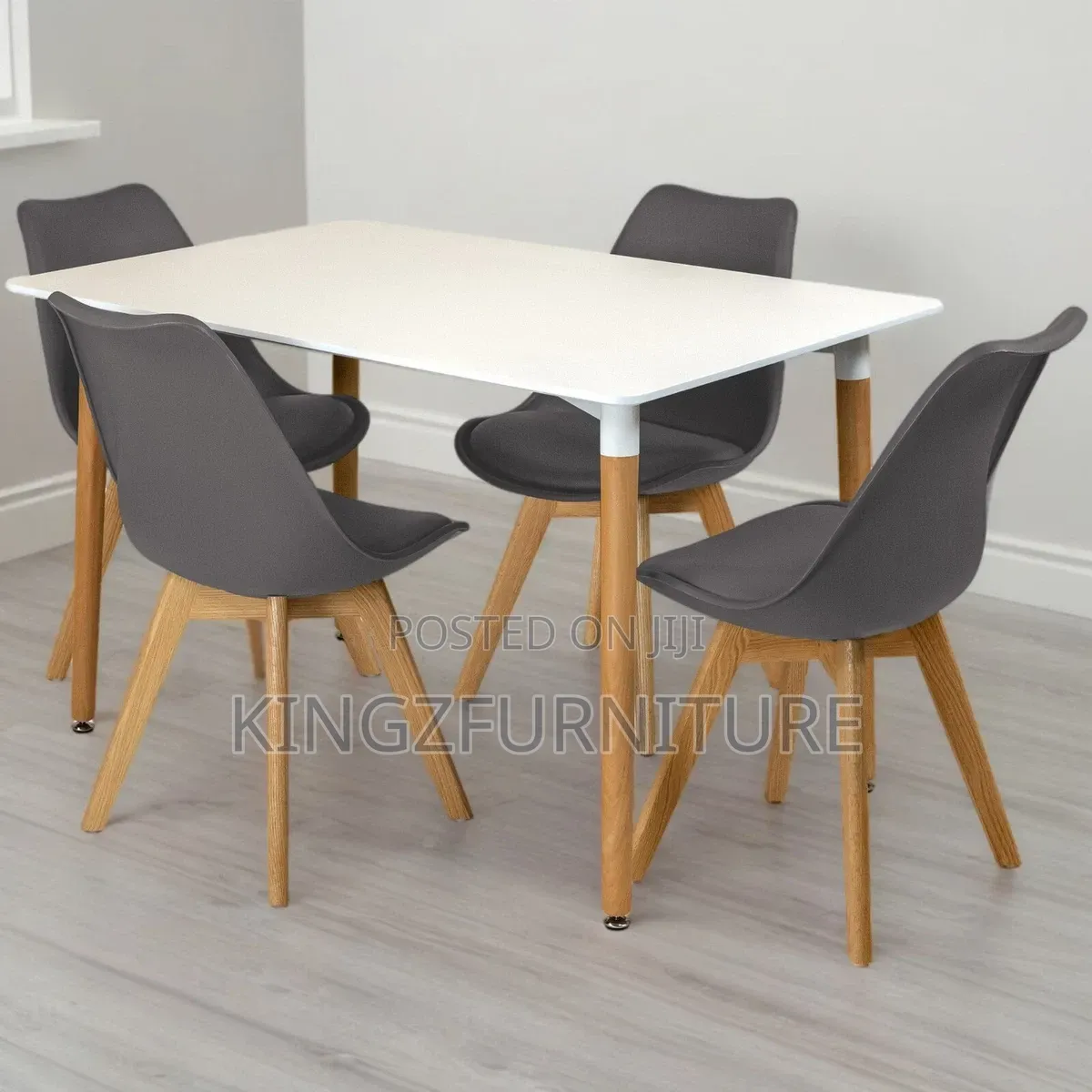 Rectangular Dining Table Set Features a White Top and Four Grey Chairs