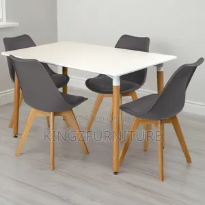 Rectangular Dining Table Set Features a White Top and Four Grey Chairs