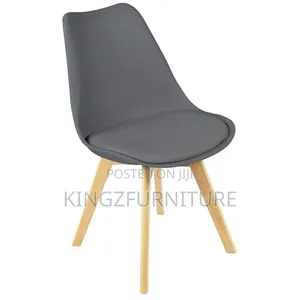 Rectangular Dining Table Set Features a White Top and Four Grey Chairs