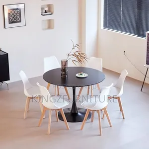 A Circle Dining Table and Four Matching Chairs.