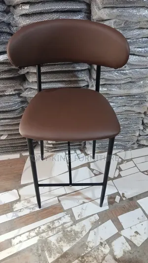 Modern Bar Stool Features a Brown Leatherette Padded Seat.