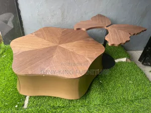 Luxury Coffee Table Set a Wooden Top With a Side Stool Black Base.