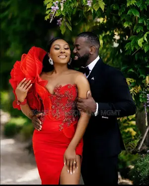 Red Split Leg Gown and Black Suit