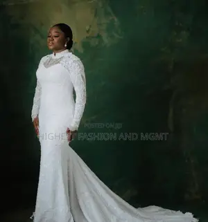 White Lace Gown and Tailored White Tuxedo
