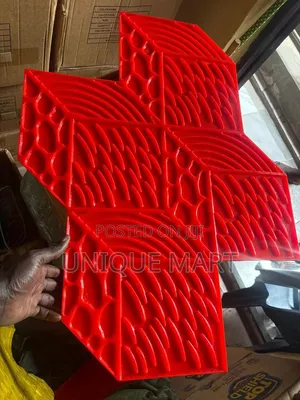 Red Stamp Mat Used for Creating Textured Pattern on Concrete Surfaces