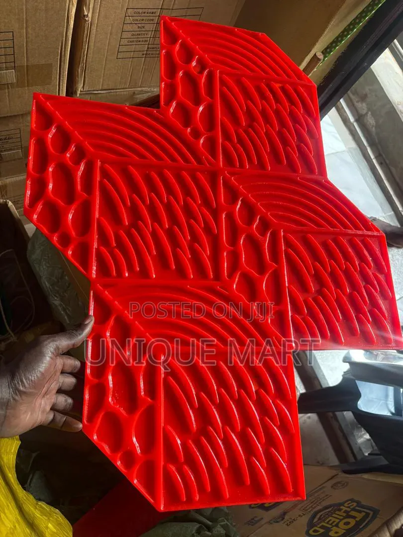Red Stamp Mat Used for Creating Textured Pattern on Concrete Surfaces
