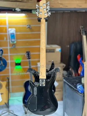 String Electric Bass Guitar With a Glossy Black Finish.