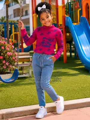 Girls Pink Sweater With Blue Drawstring Jeans