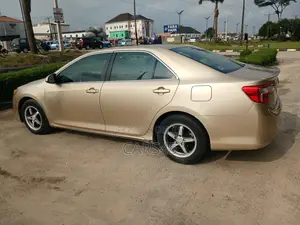Toyota Camry LE 4dr Sedan (2.5L 4cyl 6A) 2012 Gold