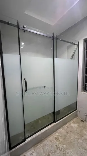 Shower Glass Cubicle With Black Accessories and Middle Frost