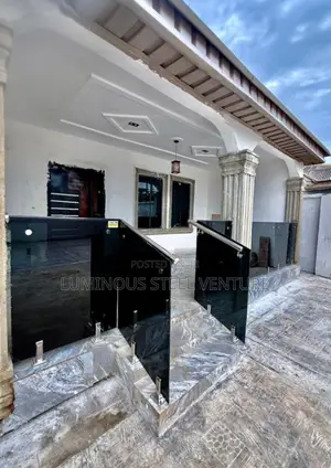 "A Sophisticated Black Glass Balcony Offering a Private, Resort-Like